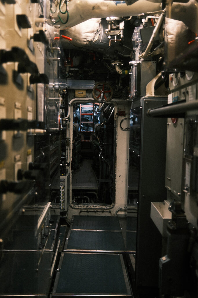 Visitors explore the narrow passageways of the U17 submarine as immersive audio recreates engine noise, sonar pings and onboard operations.